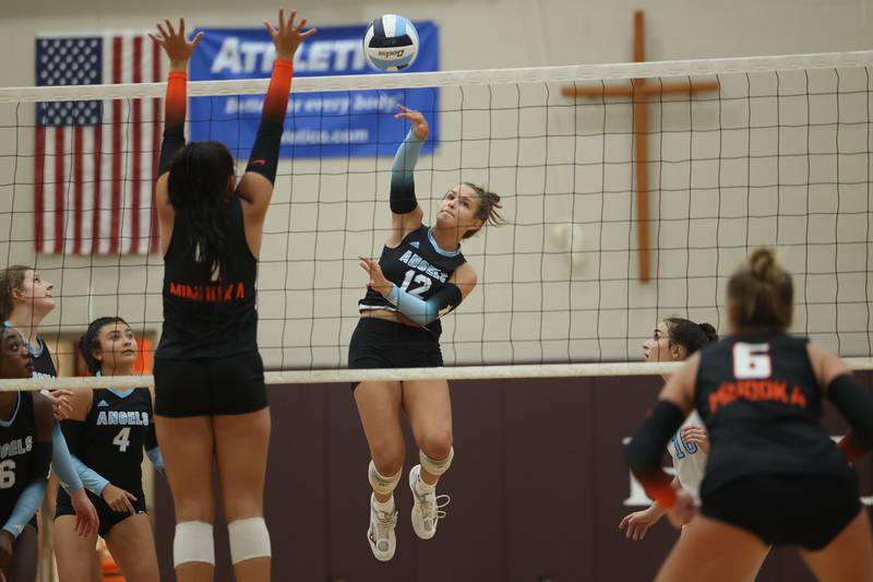Joliet Catholic’s Ellie Blotnik hits a shot against Minooka on Wednesday, Aug. 30, 2023 in Joliet.
