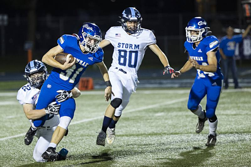 Newman’s Cody McBride is tackled by against Bureau Valley’s Elijah Endress Friday, Sept. 29, 2023 in Sterling.