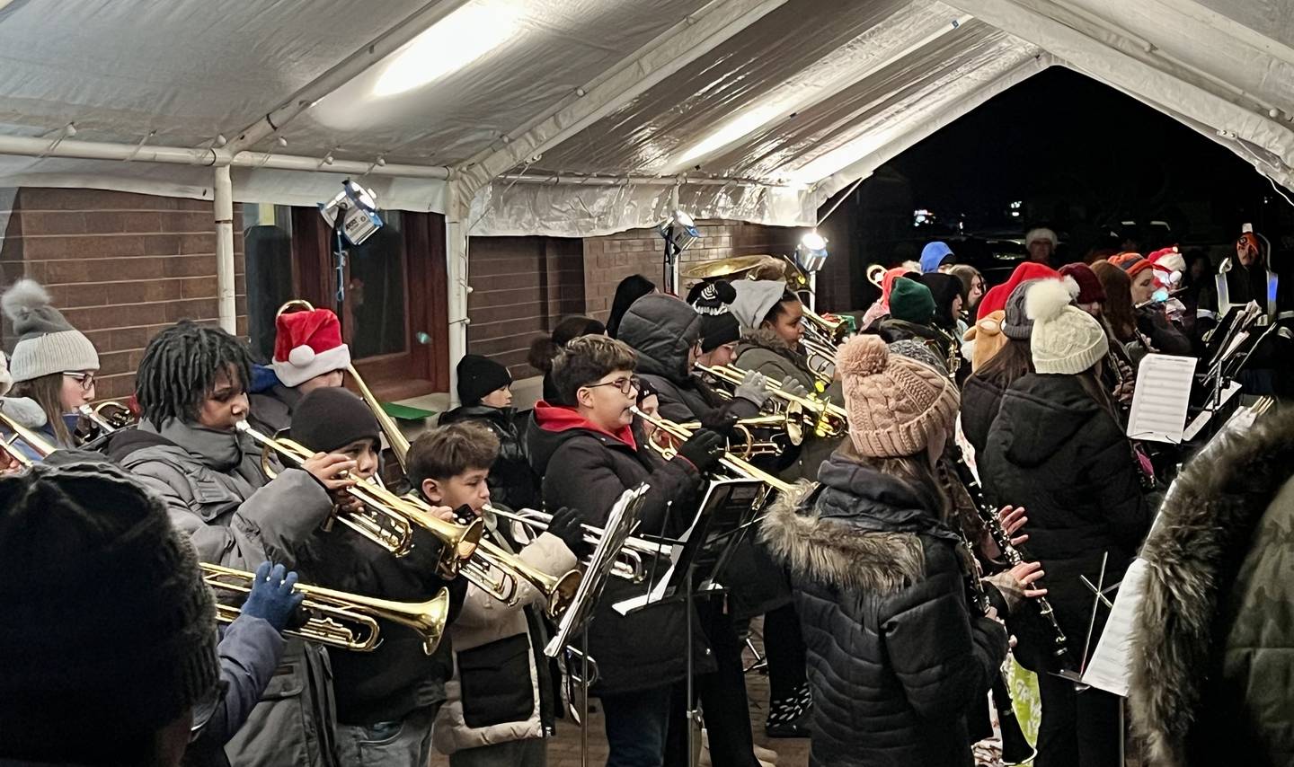 Braving cold temperatures, fourth through sixth grade students from the Emily G. Johns School Band delighted families gathered at Plano's Rockin' Christmas on Dec. 6, 2024. Local schools also donated boxes of canned goods and funds to the Kendall County Food Pantry.