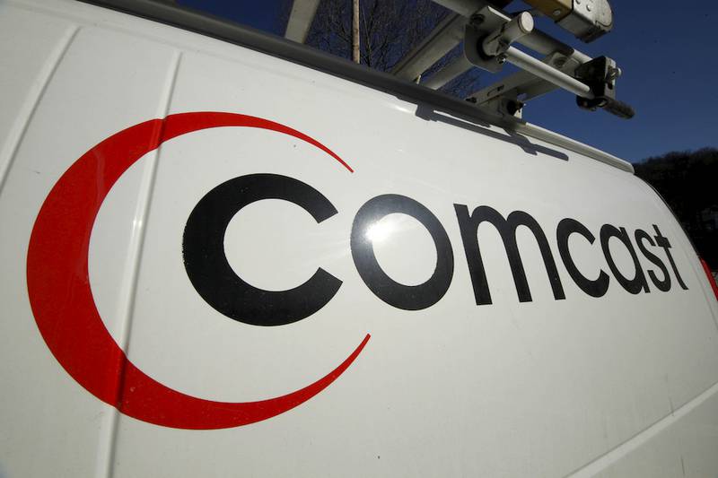 FILE - This Feb. 11, 2011 file photo shows the Comcast logo on one of the company's vehicles, in Pittsburgh. Comcast has agreed to buy Time Warner Cable for $45.2 billion in stock, or $158.82 per share, in a deal that would combine the top two cable TV companies in the nation, according to a person familiar with the matter who spoke on condition of anonymity because it had not been announced formally. An announcement is set for Thursday morning, Feb. 13, 2014, the person said. (AP Photo/Gene J. Puskar, File)