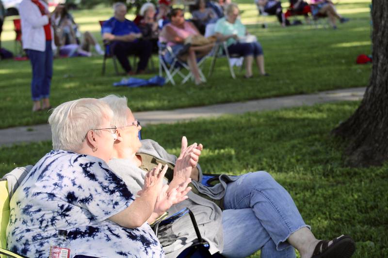 Concert-goers applaud at the conclusion of the opening set by Kathy Cecchetti and the Acoustic Circus on Friday at John Dixon Park in Dixon. It was the opening night of the Music at the Square summer series.