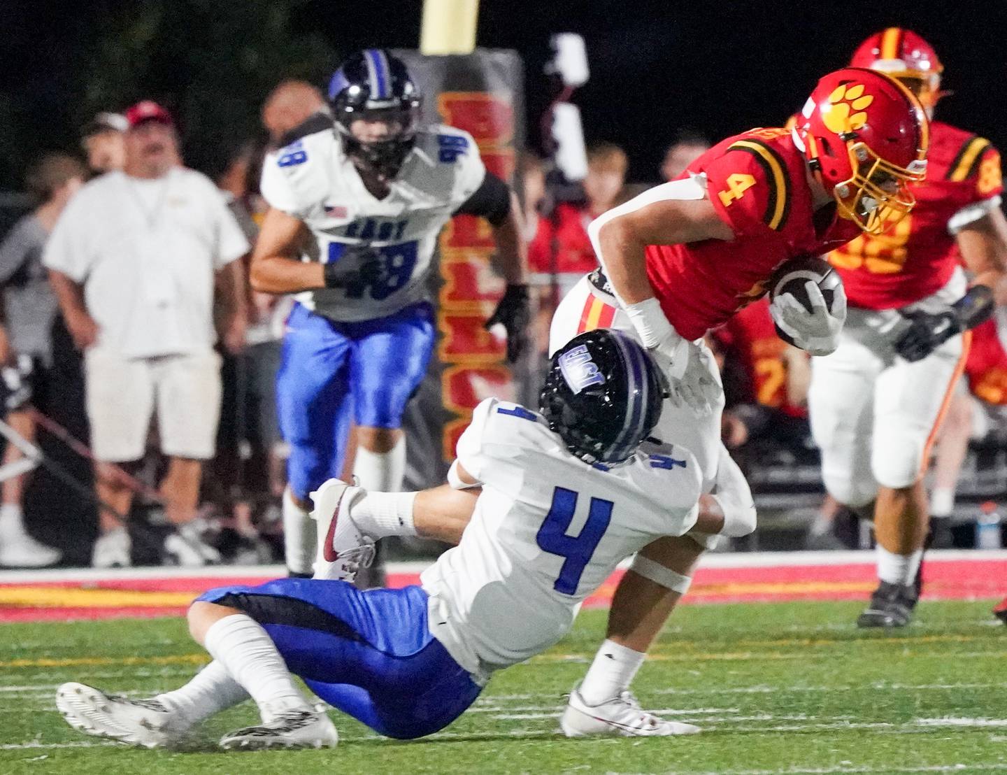 Batavia's Charlie Whelpley runs after the catch against Lincoln-Way East's Kade Fatland during a football game at Batavia High School on Friday, Sep 1, 2023.