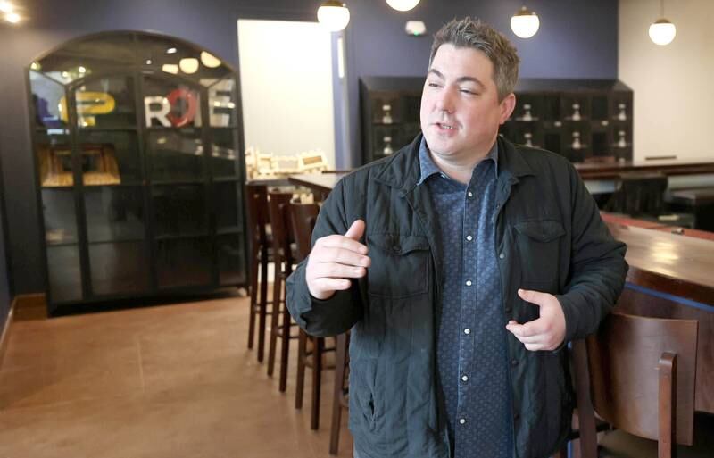 One of The Grove restaurant and bar owners Jason Engstrom talks about the cocktails Thursday, March 23, 2023, that will be available at the new eatery in DeKalb. They plan to open their doors upon completion within the next few weeks.