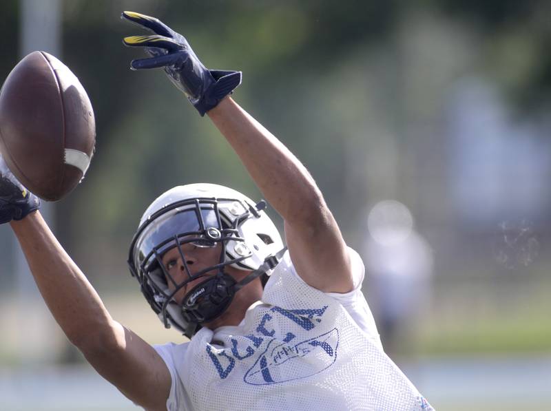 Geneva’s Talyn Taylor makes a catch during the first day of practice for the fall season on Monday, Aug. 7, 2023 at the school.