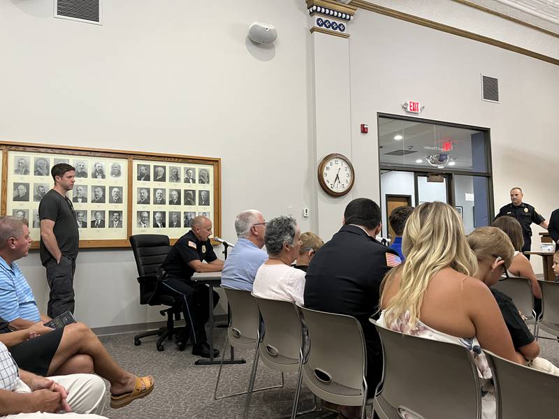 Dixon Police Department’s Deputy Chief Matt Richards (middle left) talks about former Sgt. Matthew Coppotelli's 27 year career at the department. Coppotelli retired on Jan. 18, 2024, and now serves as Polo's chief of police.