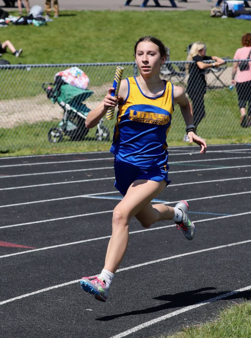 Ruby Acker runs the 4x400 anchor leg for the Princeton Logan 8th grade girls team in the Bureau County Junior High School track meet.