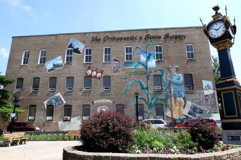 The mural titled “Its Merits Recommend It...” by artist Olivia Gude Tuesday, July 22, 2025. The artwork graces the side of the building at the corner of Lincoln Highway and First Street in DeKalb.
