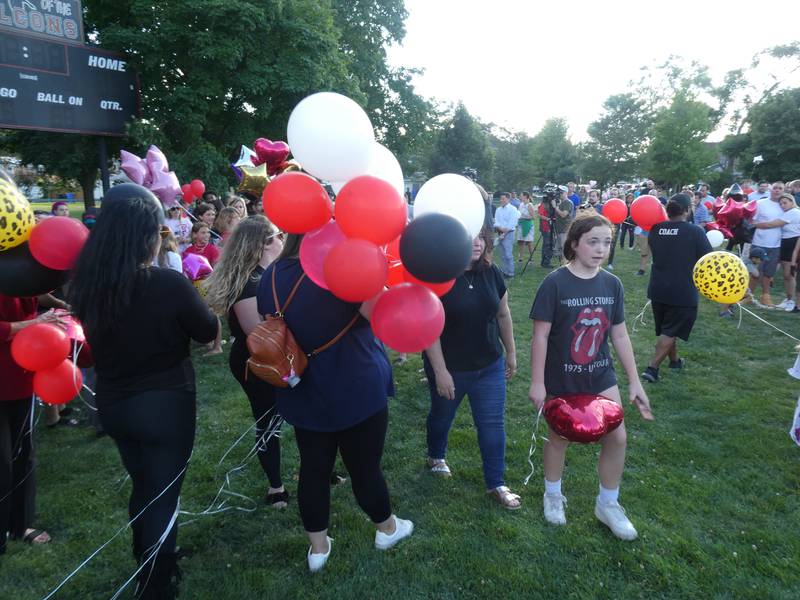 A prayer vigil and balloon release was held at Oriole Park in Chicago on Monday night, August 1, 2022 to mourn the loss of seven killed, including Lauren Dobosz and her four children, in a tragic car crash that occurred Sunday on I-90 near Hampshire.