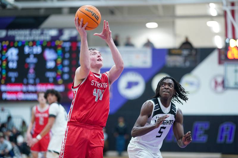 Streator's Nolan Lukach (44) shoots the ball in the post against Kaneland's Freddy Hassan (5) during a semi-final basketball game in the 61st annual Plano Christmas Classic at Plano High School on Friday, December 27, 2024.