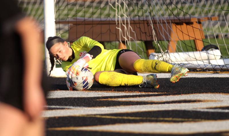 Wheaton Warrenville South goalkeeper Marilyn Dixon makes a save during a game against St. Charles East in Wheaton on Tuesday, April 18, 2023.