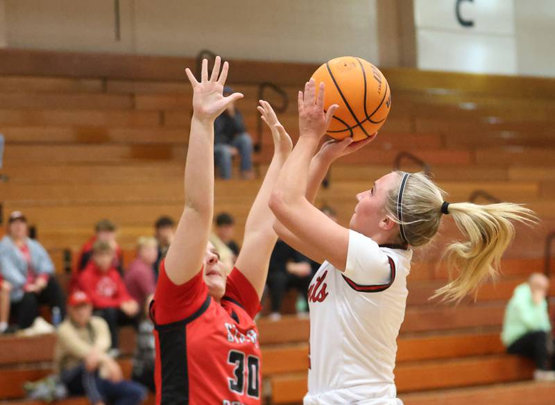 Hall's Charlie Pellegrini takes a jump shot over Stark County's Adelynn Gibson during the Tiger Girls Basketball Holiday Tournament on Tuesday, Nov. 18, 2025 at Princeton High School.