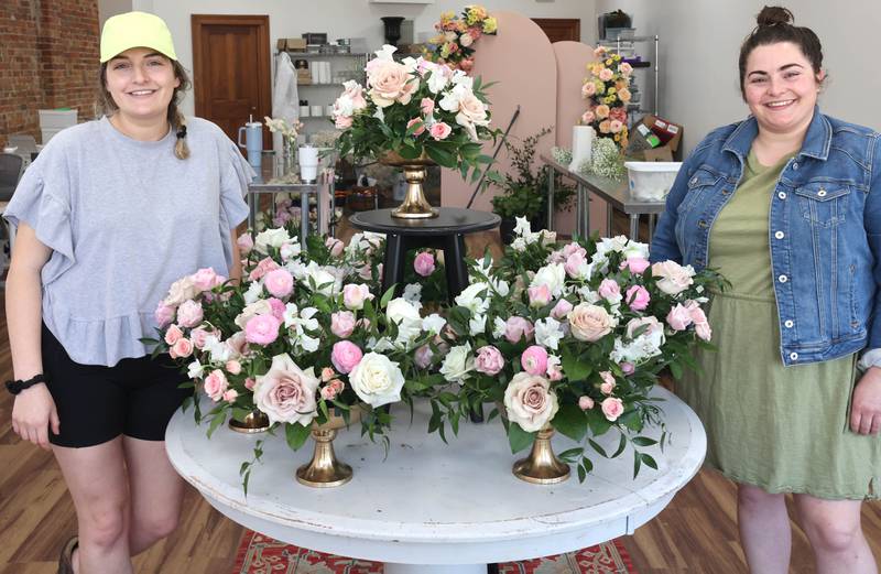 Willrett Flower Company Owners Kat Willrett (left) and her sister Mary Grace McCauley with some arrangements they put together Friday, May 13, 2022, at the store at 302 E. Lincoln Highway in DeKalb. The location will soon be filled with flowers and gift items as they get ready for the opening in June.