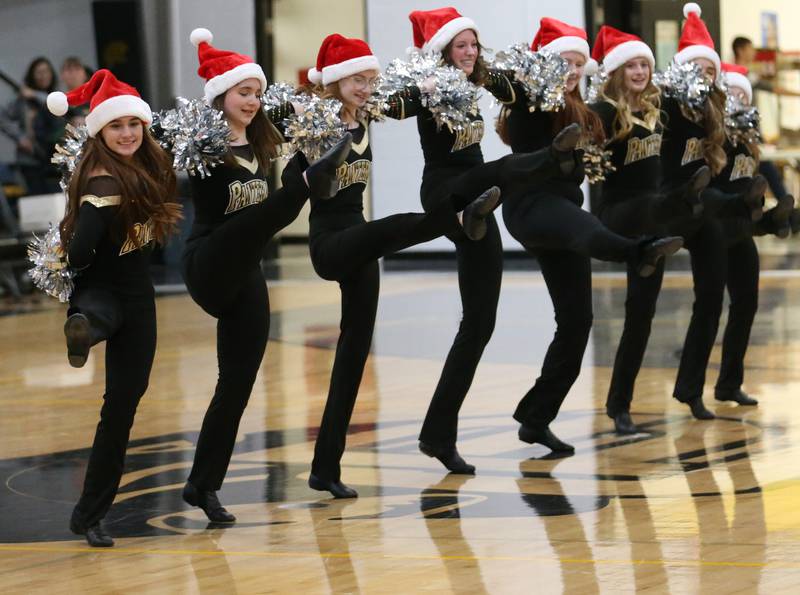 The Putnam County Lady Panther Dance Team performs the kick line at halftime during the game against Seneca on Friday, Dec. 16, 2022 at Putnam County High School.