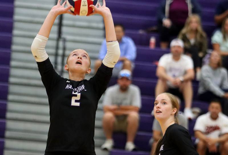 Hampshire’s Ella Ingve sets the ball against Prairie Ridge in varsity girls volleyball at Hampshire High School in Hampshire on Tuesday, Sept. 2, 2025.