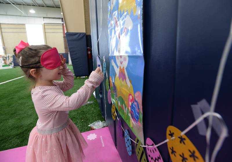 Children including Nora Pavelko of Glen Ellyn enjoy the Glen Ellyn Park District's Hoppy party Saturday, March 30, 2024.
