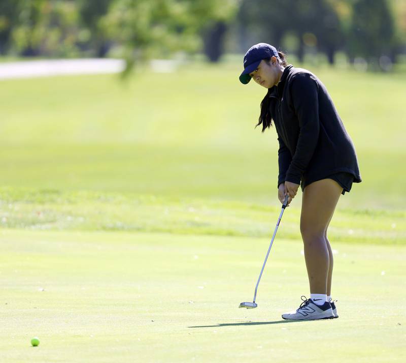 Angel Nguyen of Glenbard North, watches her putt during the IHSA Class 2A West Chicago girls golf regional at St. Andrews Tuesday, Oct. 1, 2024 in West Chicago.