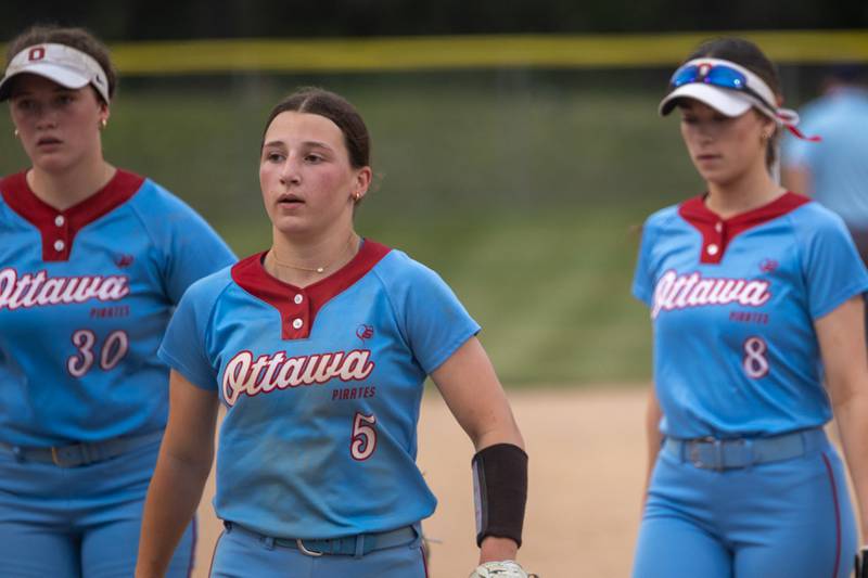 (left to right) Aubrey Sullivan, Avery Leigh and Annamaria Corsolini walk in disappointment on Tuesday, June 3, 2025 at Ottawa High School in Ottawa.