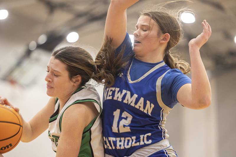 Newman’s Lucy Oetting and Wethersfield’s Camryn Anderson fight for a rebound Thursday, Feb. 26, 2026, in the Class 1A sectional final at Eastland.