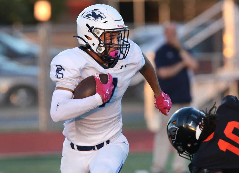 Plainfield South's Sebastian Thomas picks up yardage on a kick return during their game against DeKalb Friday, Sept. 1, 2023, at DeKalb High School.