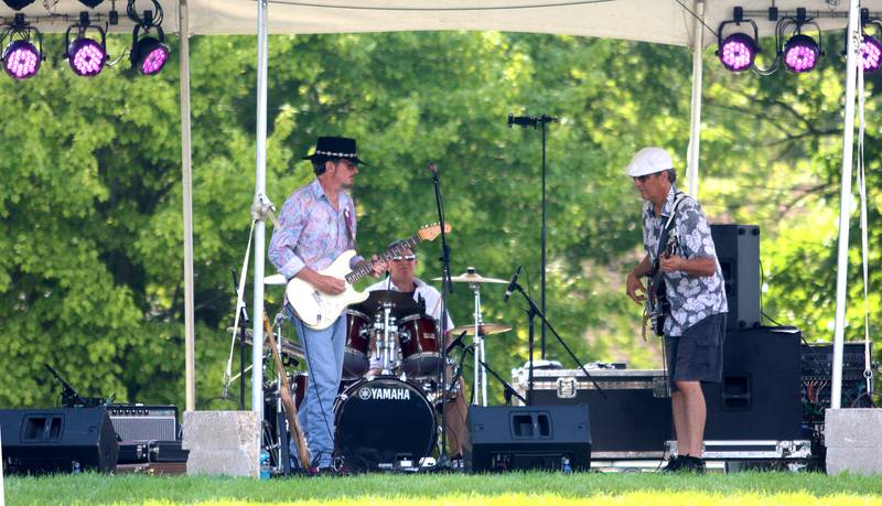 The Wall of Denial Band entertains during the final day of Bands, Brews, and BBQ at McHenry’s Petersen Park Sunday. The three-day event was hosted by the McHenry Area Rotary Club and 100% of the proceeds will go to charities such as Kids in Need McHenry County, McHenry Riverwalk Shoppes, and more.
