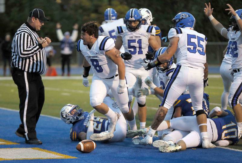 Brian Hill/bhill@dailyherald.com
Lake Zurich's Calen Grabowski (8) emerges from the pack after scoring against Wheaton North during the second round of the IHSA playoffs Saturday November 5, 2022 in Wheaton.