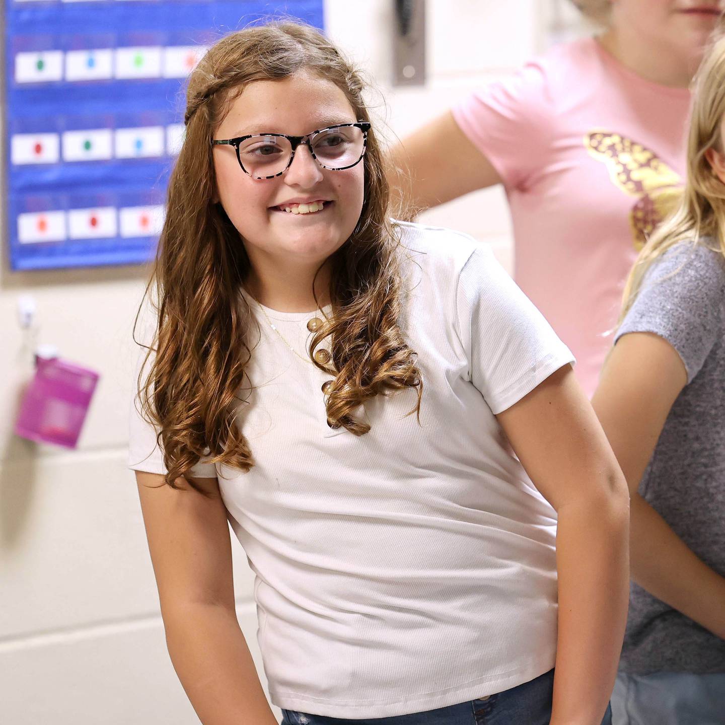 Kylie Leitsch, a fifth grader at Genoa Elementary School, listens to her teacher during the first day of school Wednesday, Aug. 16, 2023, in their class at the school.