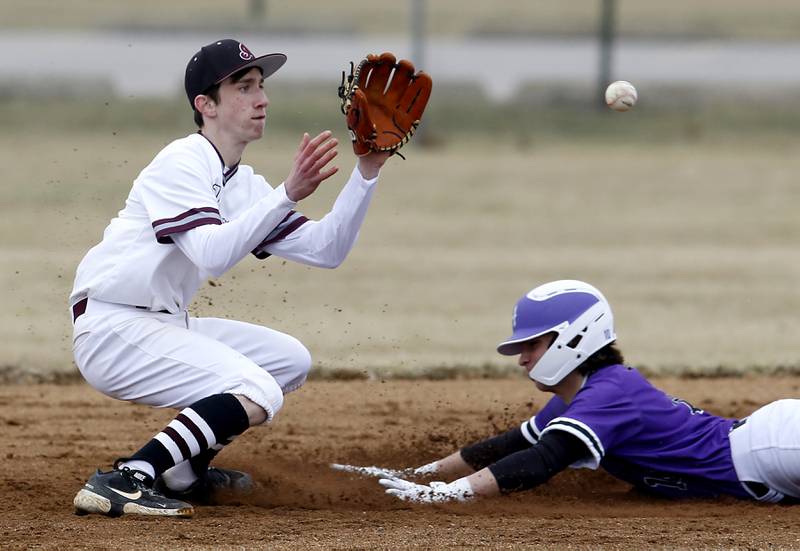 Marengo's Patrick Signore waits for the throw as Hampshire's Dominic Borecky slides into second base during a non-conference baseball game Wednesday, March 30, 2022, between Marengo and Hampshire at Marengo High School.