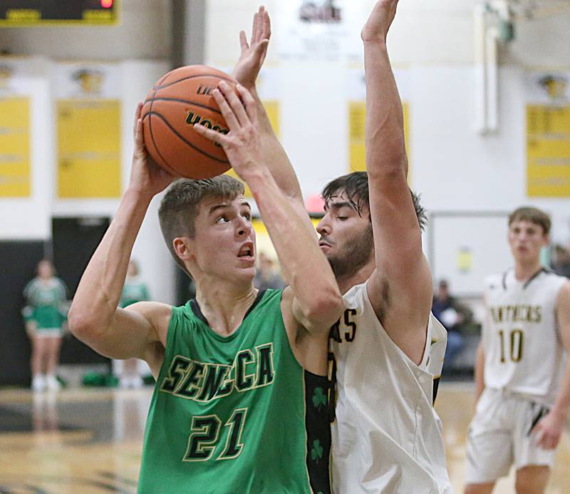 Seneca's Lane Provance looks to get around Putnam County's Jackson McDonald on Friday, Dec. 16, 2022 at Putnam County High School.