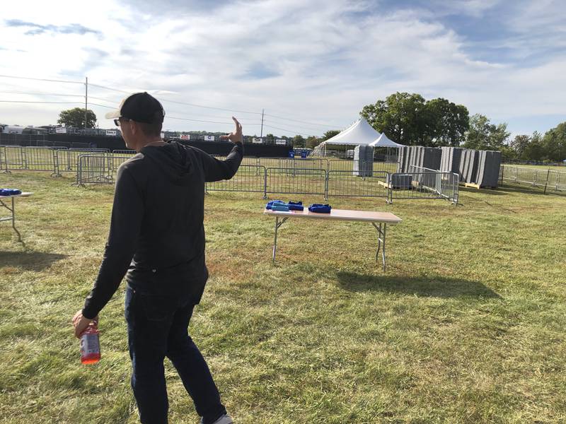 McHenry Mayor Wayne Jett motions on Wednesday, Sept. 10, to the field at Petersen Park where the RISE Up Foundation's McHenry Music Festival is set to start on Friday. The festival runs each Friday, Saturday and Sunday starting at about 4:30 p.m., with gates opening at 3:30 p.m.