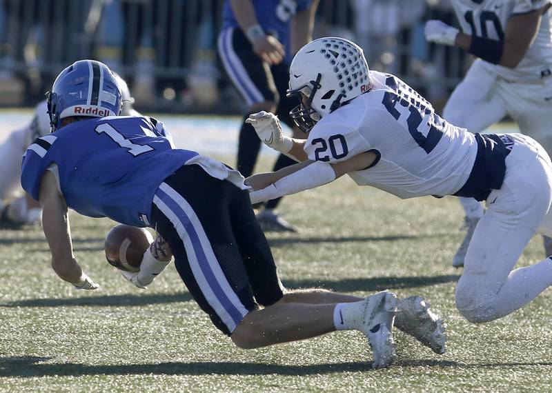 Cary-Grove's Connor Anderson breaks up a pass intended for Lake Zurich's Jackson Piggott during a IHSA Class 6A semifinal playoff football game on Saturday, Nov. 18, 2023, at Lake Zurich High School.