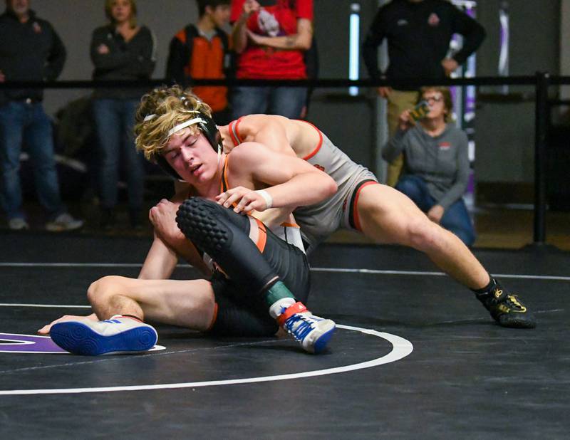 Sy Smith of Sandwich tries to get around Gibson City wrestler in the 145 wieght class on Saturday Dec. 10th where he took 4th during the Plano Reaper wrestling classic held at Plano High School.