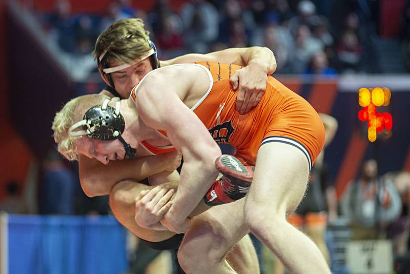 DeKalb's Bryson Buhk (front) works against Marist's Peter Marinopoulos in the 195lb 3A semis.