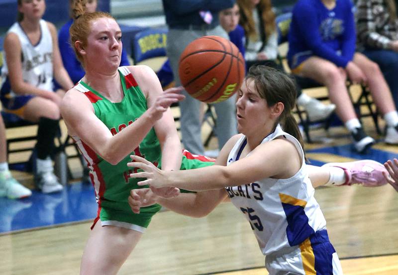 LaSalle-Peru's Addie Duttlinger saves the ball from going out-of-bounds as Somonauk's Kennedy Barshinger plays defense during their game Thursday, Nov. 16, 2023, in the Tim Humes Breakout girls basketball tournament at Somonauk High School.
