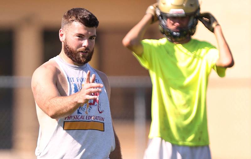 Hiawatha football head coach Nick Doolittle instructs his team Wednesday, Aug.10, 2022, during practice at the school in Kirkland.
