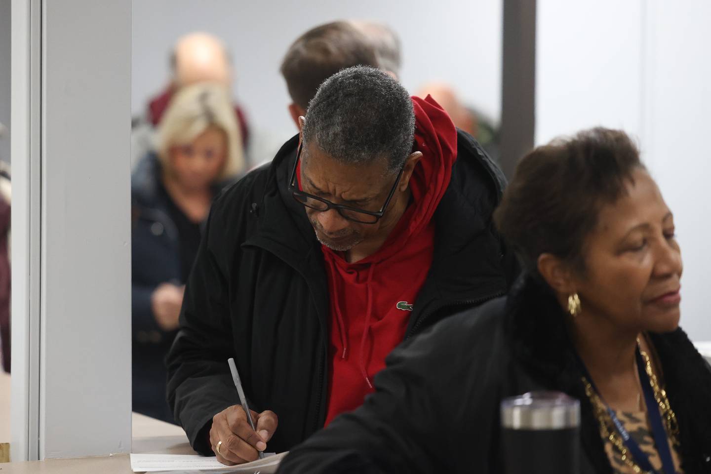 Herbert Brooks Jr. fills out paperwork for his petition for the 2024 county elections at the Will County Building in downtown Joliet on Monday, Nov. 27, 2023.