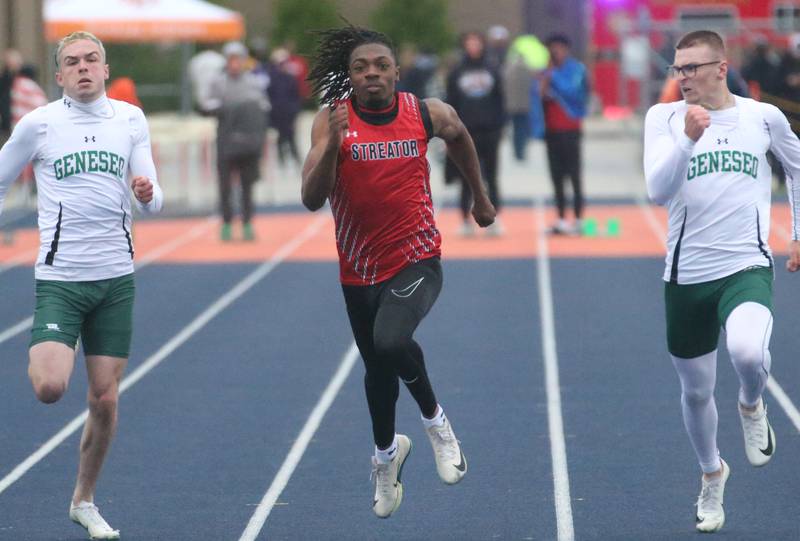 Streator's Isaiah Brown (center) wins the 100 meter dash during the Class 2A Sectional meet on Wednesday, May 21, 2025 at Pontiac High School.