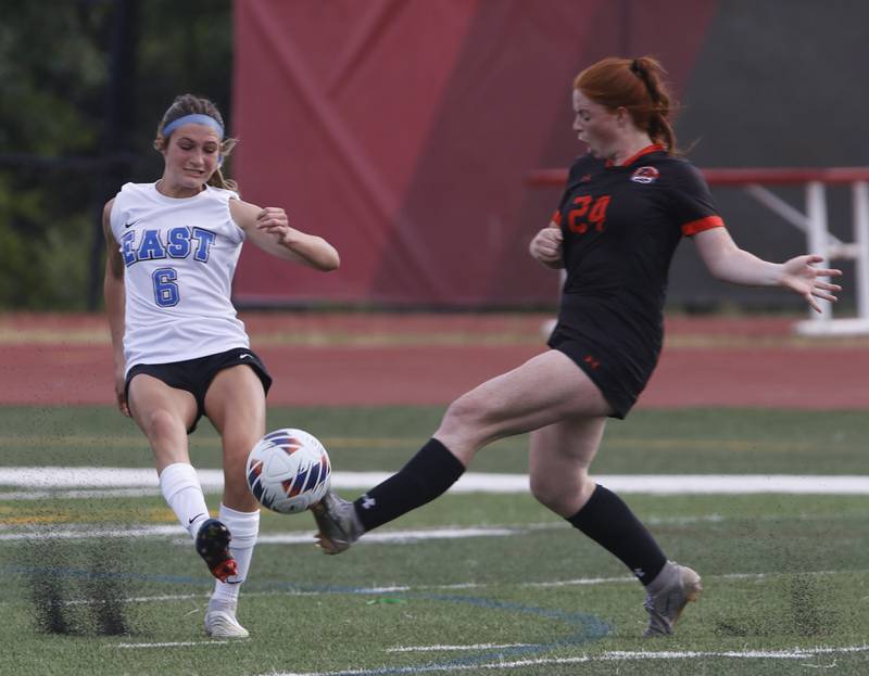 Libertyville’s Ellie Rebman gets her foot on the ball to block the kick of Lincoln-Way East's Thea Gerfen in the IHSA Class 3A state third-place match at North Central College in Naperville on Saturday, June 3, 2023.
