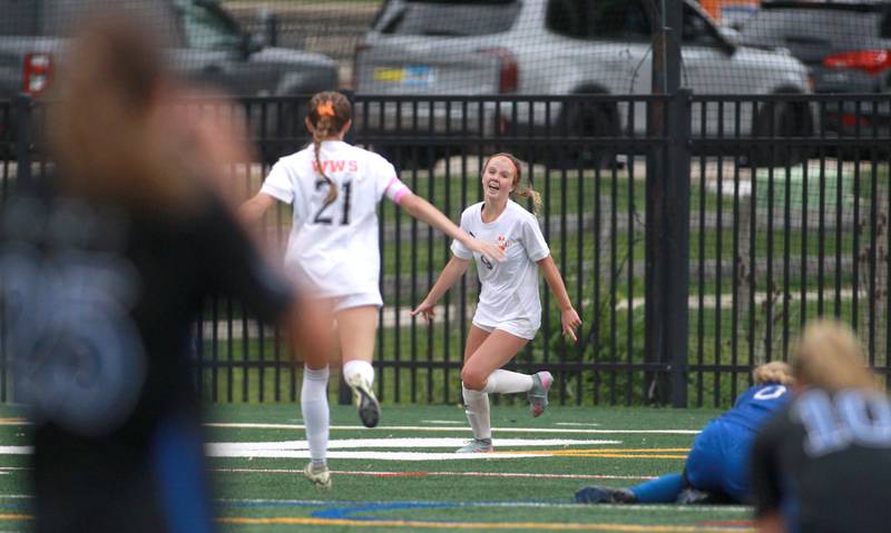Wheaton Warrenville South's Ashlyn Adams and Kelsey Clousing celebrate a goal during the Class 3A Glenbard West Sectional final against St. Charles North on Friday, May 30, 2025 in Glen Ellyn.
