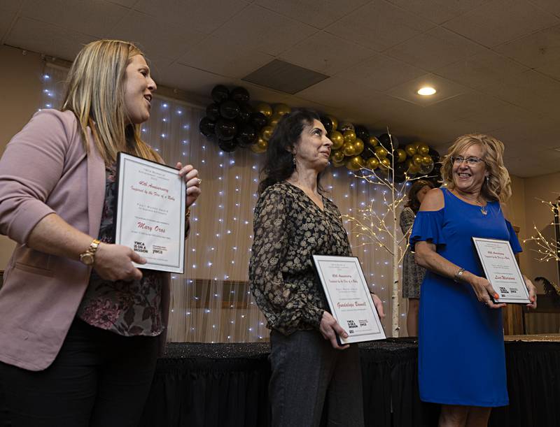 Guadalupe Bonnell (middle) reacts after being named the recipient of the Pearl Woods Award for Business and Industry Thursday, April 13, 2023 at the YWCA Women of Achievement Luncheon. Other nominees were Mary Oros (left) and Lisa Wiersema.