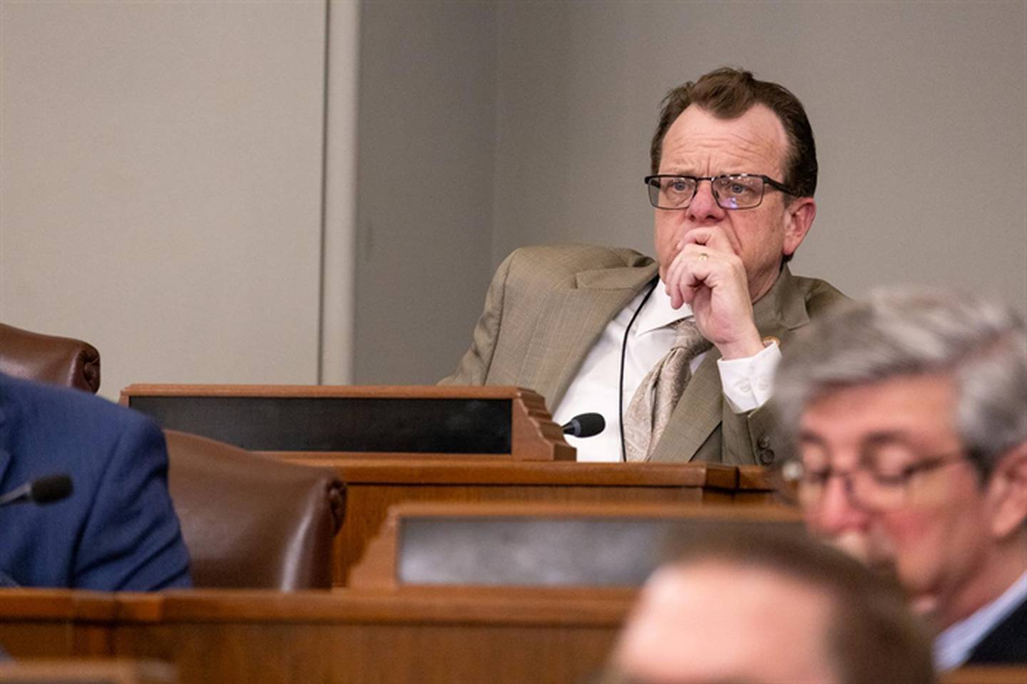 Rep. Larry Walsh, D-Elwood, looks out over a House Public Utilities Committee hearing in which environmentalists, consumer advocates, unions and representatives of the energy sector debated the benefits and drawbacks of “right of first refusal” legislation.