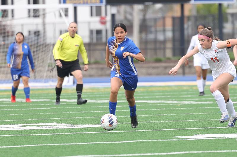 Joliet Central’s Kathleen Hernandez works the ball upfield against Plainfield East on Thursday, April 11, 2024.