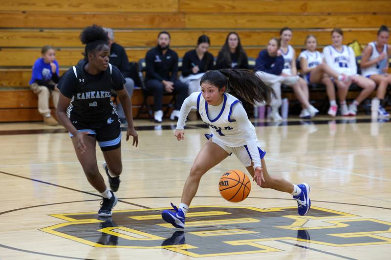 Rosary's Aleah Luna drives across half court against Kankakee's London Stroud during the Kays' 75-28 victory over Rosary at the Reed-Custer Classic on Monday, Nov. 17, 2025.