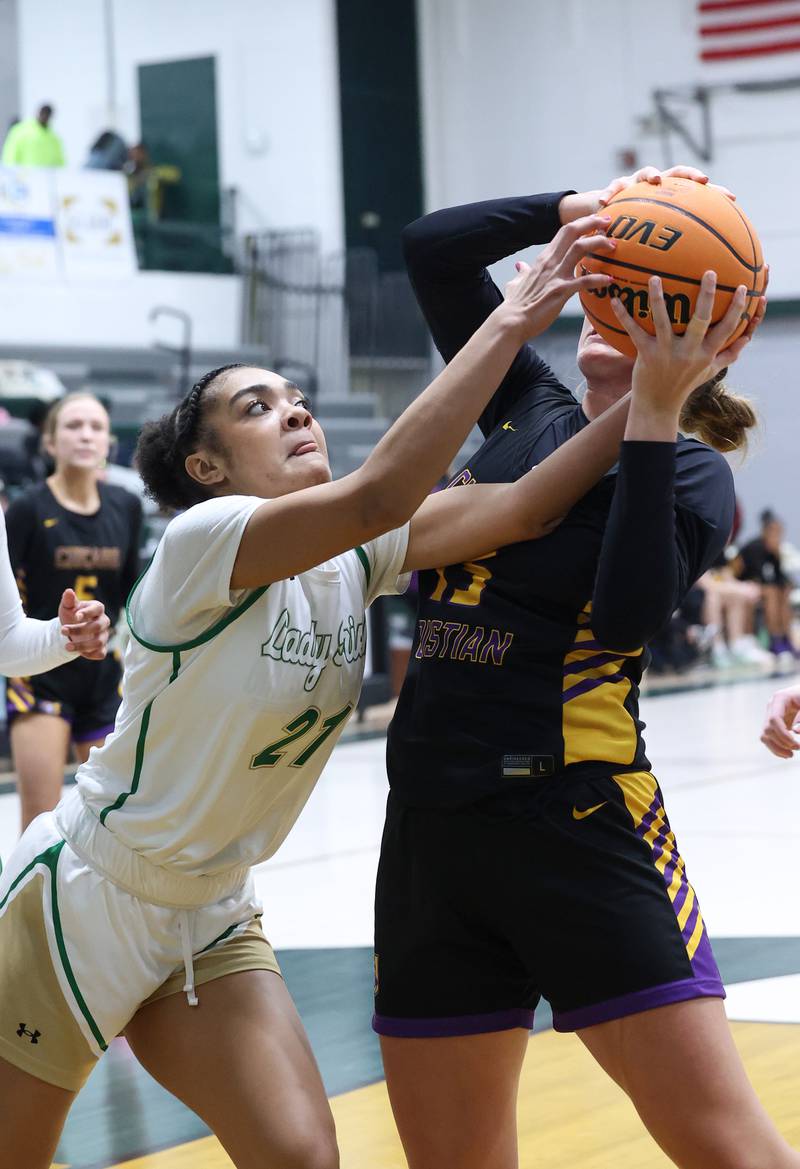 Bishop McNamara's Keneyce Davis fights for a rebound during the Fightin' Irish's 67-27 victory over Chicago Christian on Monday, Jan. 26, 2026.