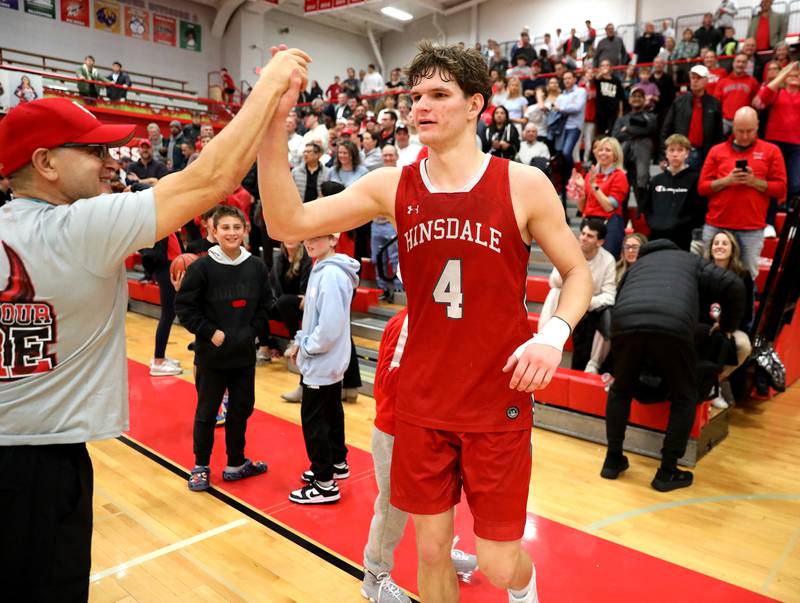 Hinsdale Central’s Vincas Buzelis celebrates their win over Brother Rice during the Hinsdale Holiday Classic championship game on Monday, Dec. 30, 2024 in Hinsdale.