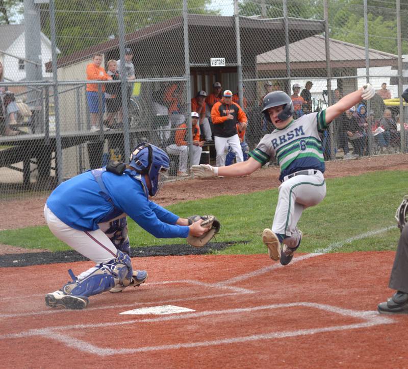 Eastland catcher Brody Sims gets ready to tag out River Ridge's Sam Rife at the 1A Lena-Winslow Sectional on Wednesday, May 28, 2025.