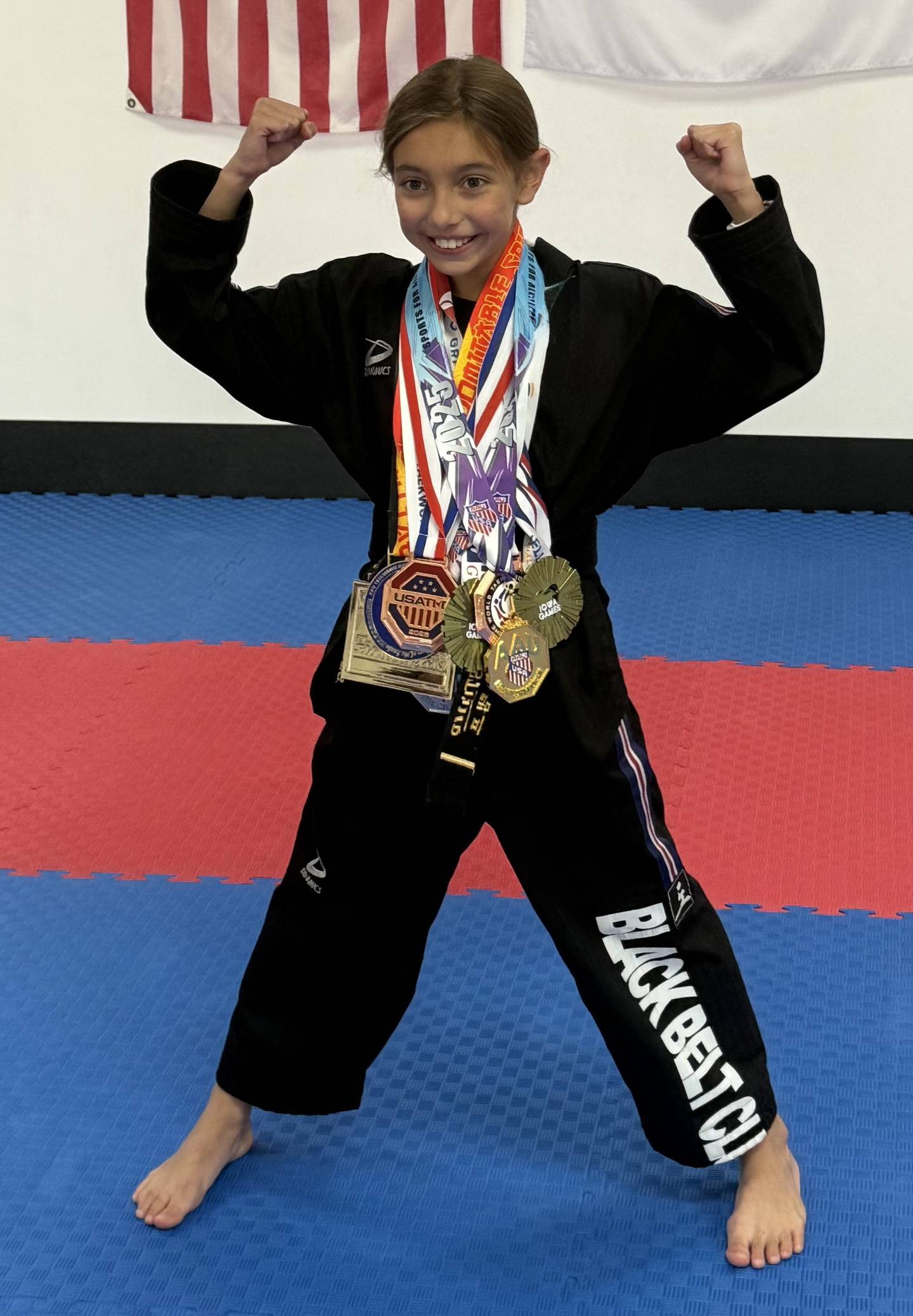 10-year-old Delilah Stamp shows off all of the medals she has won over this year practicing taekwondo.