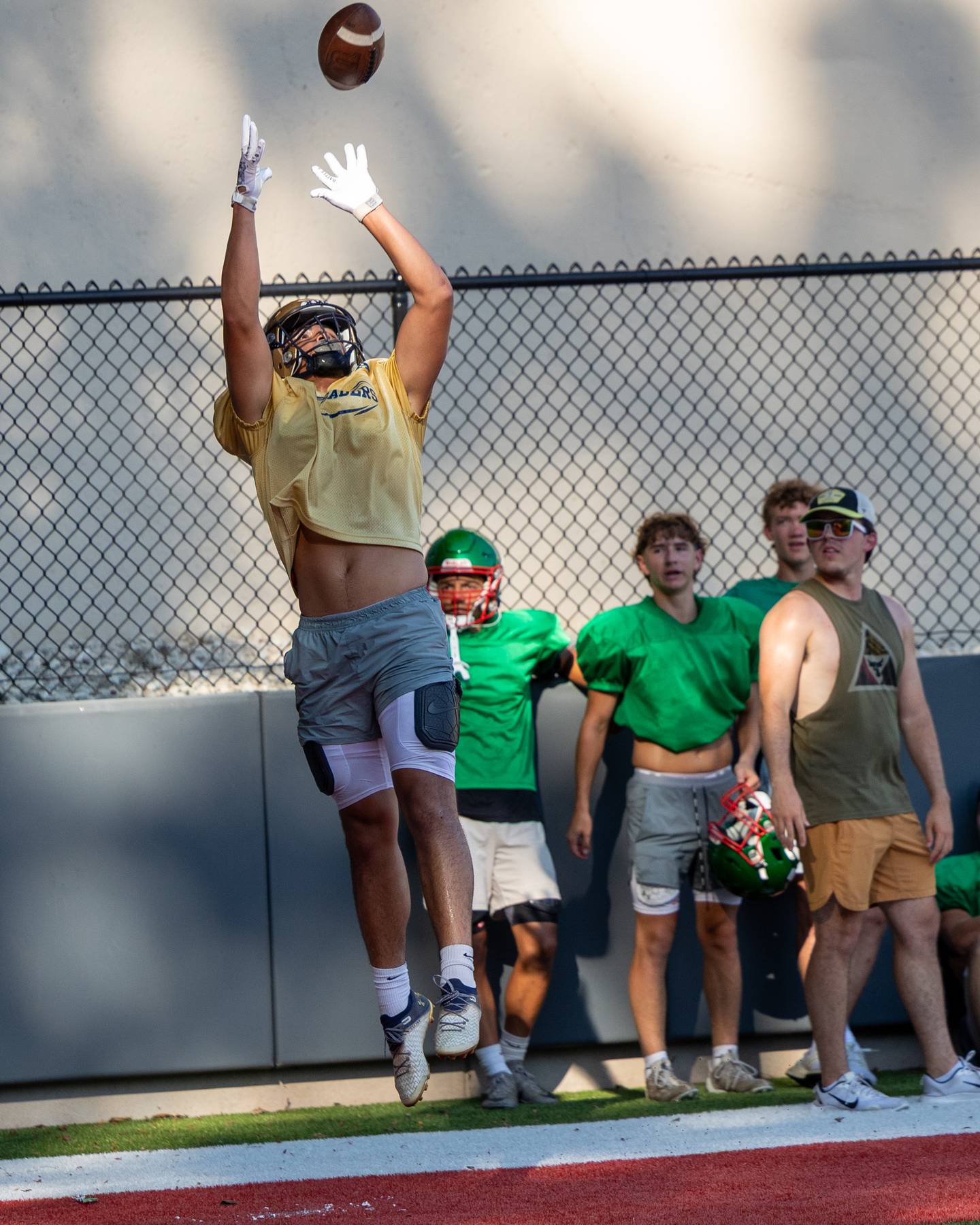 Blayden Cassel of Marquette leaps for catch during scrimmage against La Salle-Peru on Tuesday July 16, 2025 at Howard Fellows Stadium in LaSalle.