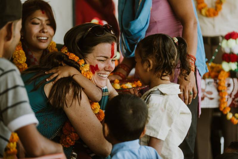 Katie Hilborn with children in Nepal who are being assisted by her Global Orphan Prevention foundation.