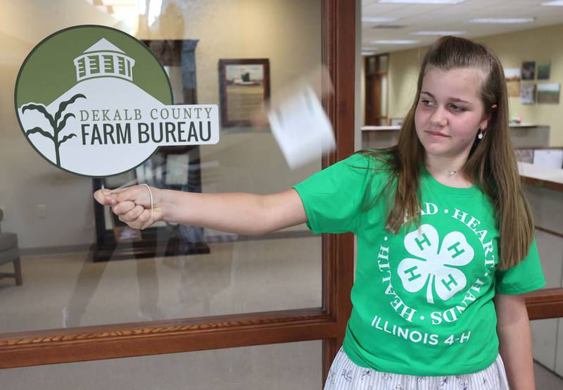 Volunteer Maggie Kushnick, 11, from Sycamore, tries out her bee buzzer noise maker Thursday, July 14, 2022, at the 4-H General Project Show at the DeKalb County Farm Bureau in Sycamore.