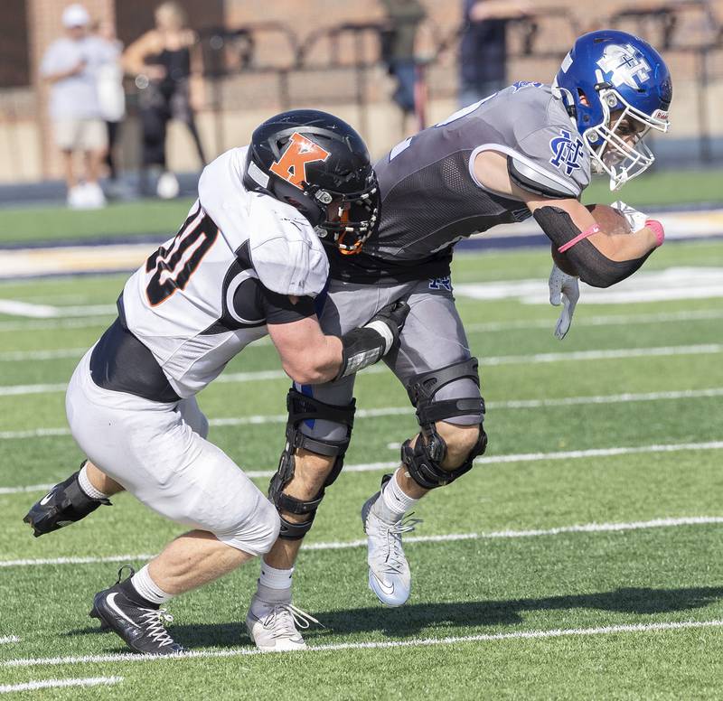 Newman’s Renner Rosengren is tackled by Kewanee’s Ace Lafollette Saturday, Oct. 18, 2025.